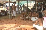 The institutor and priests offering a Mantra to a brick